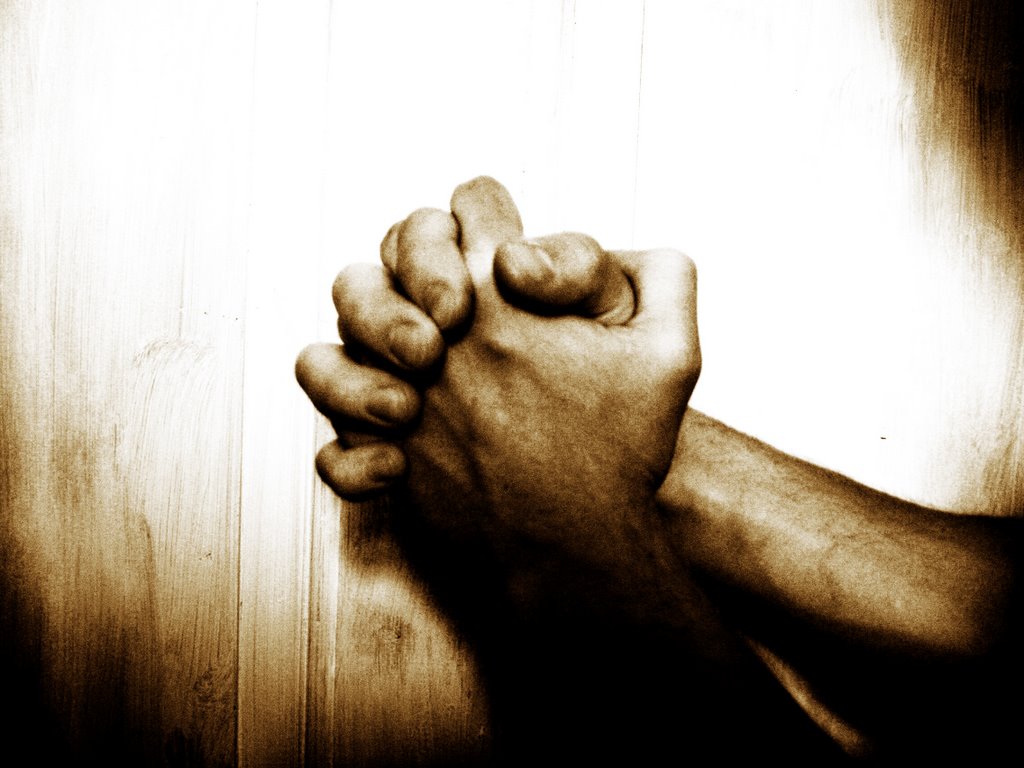clasped hands - seeking answers to prayer