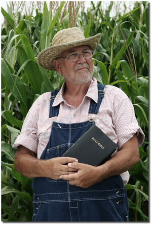 farmer holding Bible