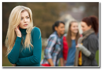girl being laughed at by small group