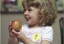 child eating an apple